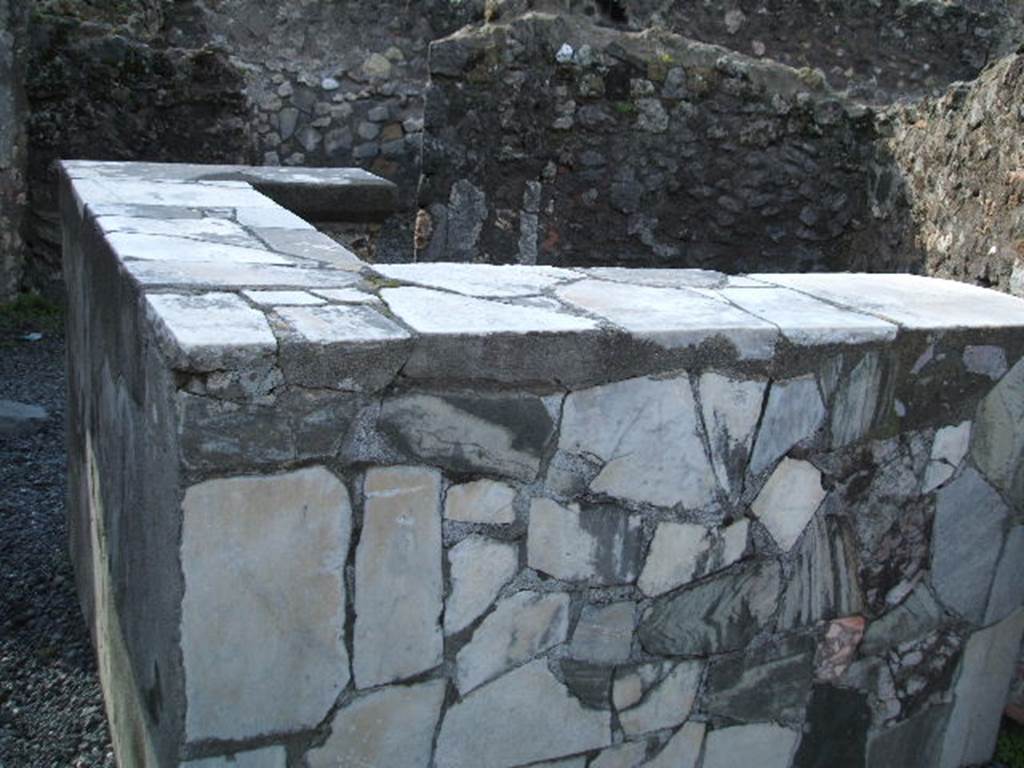 VI.4.3 Pompeii. December 2004. Three-sided marble counter.