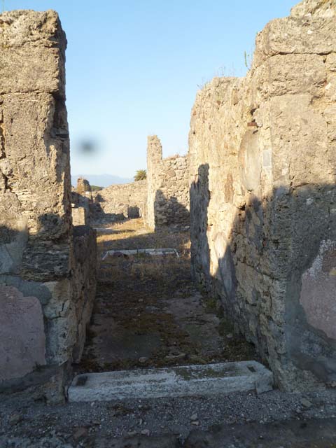 VI.5.9 Pompeii. December 2007. Looking west from south-west corner of atrium, towards stairs to upper floor and doorway to cubiculum.