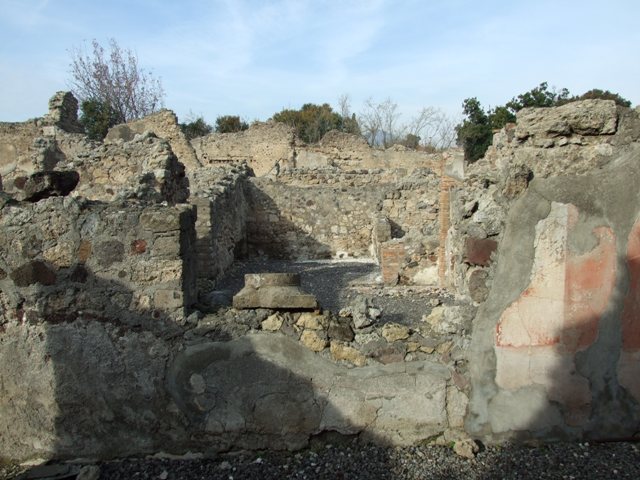VI.5.10 Pompeii. December 2007. Looking north along east portico of the peristyle with doorway to room 2, on the right.