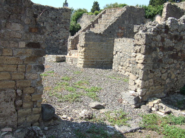 VI.5.22 Pompeii. September 2005. Looking north-west from entrance towards stairs to upper floor.