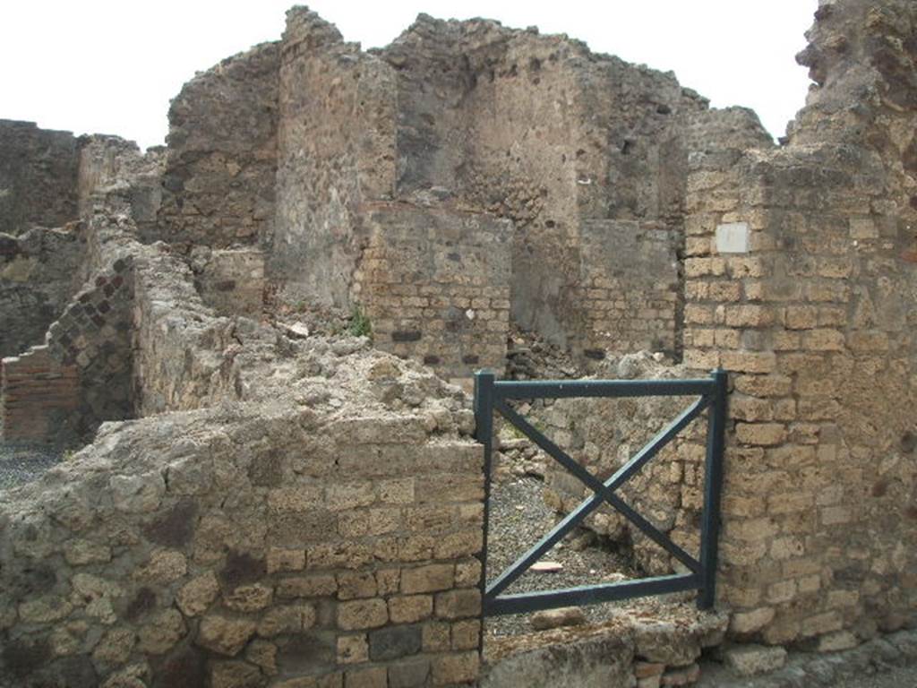 VI.6.6 Pompeii. May 2005. Looking west to entrance that led to the stairs to an independent dwelling on the upper floor. In the night of 14th-15th September 1943, a bomb fell near here destroying three rooms with four dividing walls and the perimeter wall, part of VI.6.7. See Garcia y Garcia, L., 2006. Danni di guerra a Pompei. Rome: L�Erma di Bretschneider. (p.76)
