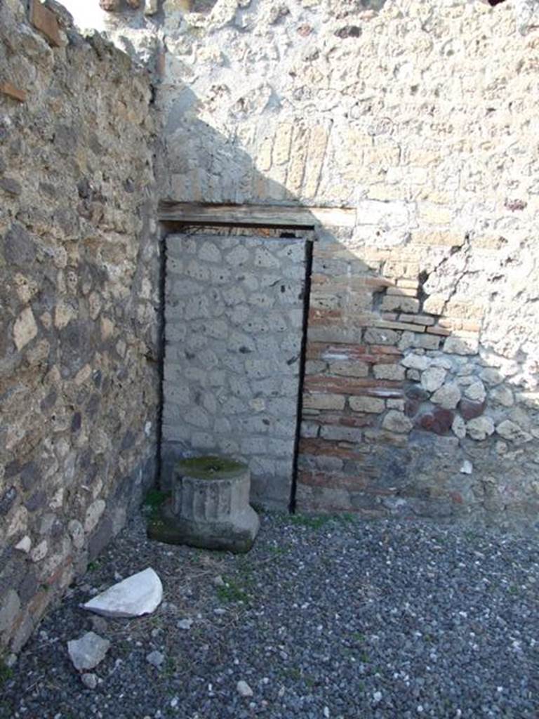 VI.7.1 Pompeii. March 2009. Blocked door in north west corner of atrium area.