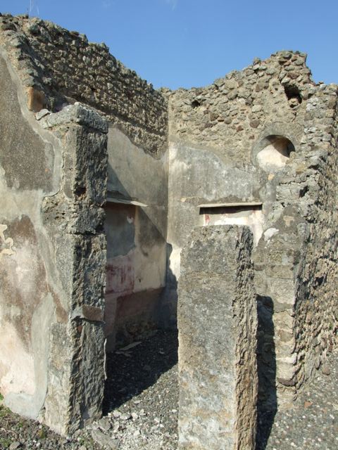VI.7.3 Pompeii. March 2009. Room 4, remains of painting on north wall with recess below.  Helbig identified two pictures in this room.  
This one was of Amphion and Zethus with a bull for sacrifice, and has now been removed.  See Helbig, W., 1868. Wandgemälde der vom Vesuv verschütteten Städte Campaniens. Leipzig: Breitkopf und Härtel. (1389,1411). See Schefold, K., 1962. Vergessenes Pompeji. Bern: Francke. (photos T 55,2; 57,1). See Bragantini, de Vos, Badoni, 1983. Pitture e Pavimenti di Pompei, Parte 2. Rome: ICCD. (p.147)

