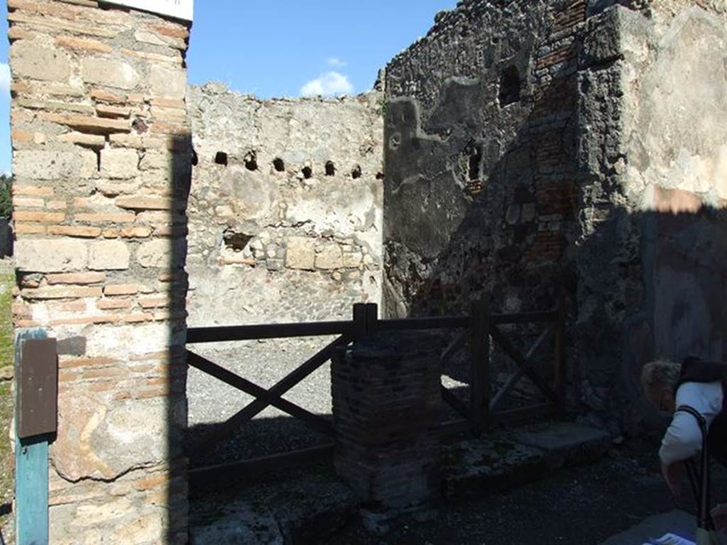 VI.7.5 Pompeii.  March 2009.  West wall with downpipe and site of VI.7.4 staircase to upper floor.