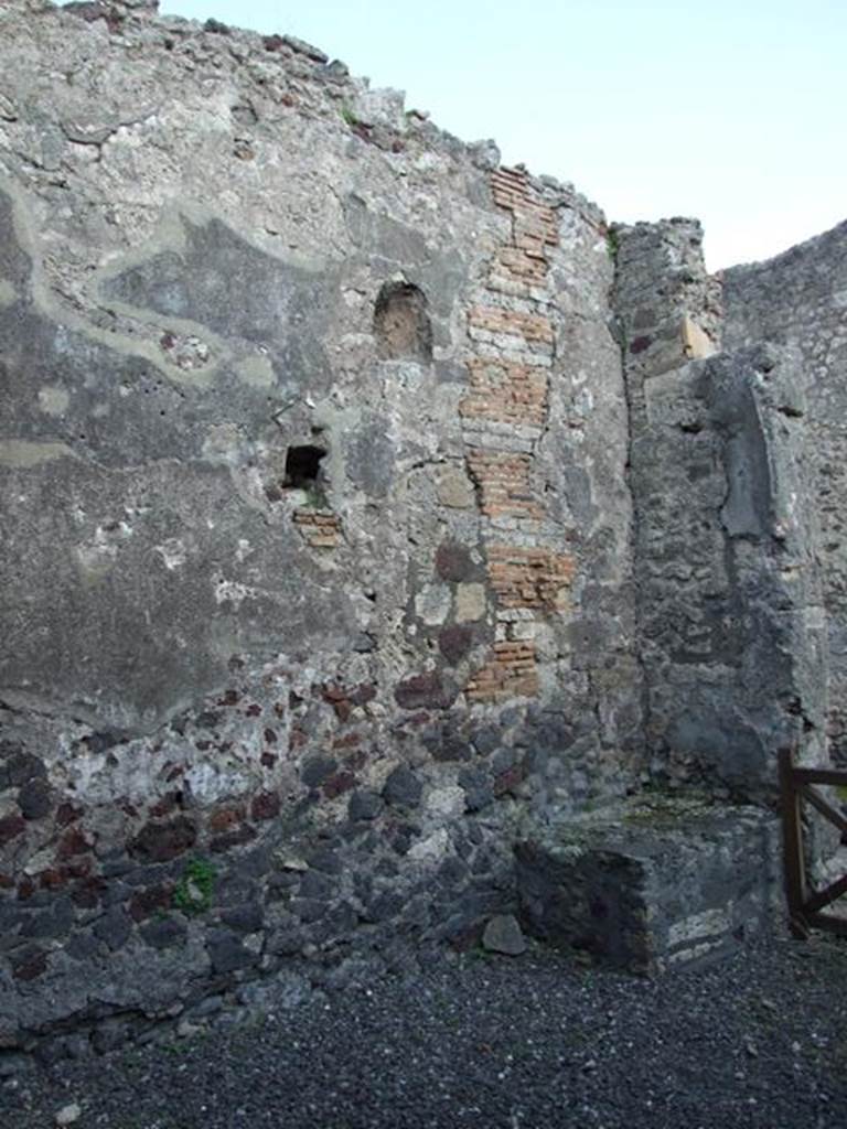 VI.7.5 Pompeii. March 2009. East wall, looking south east at niche and hearth.