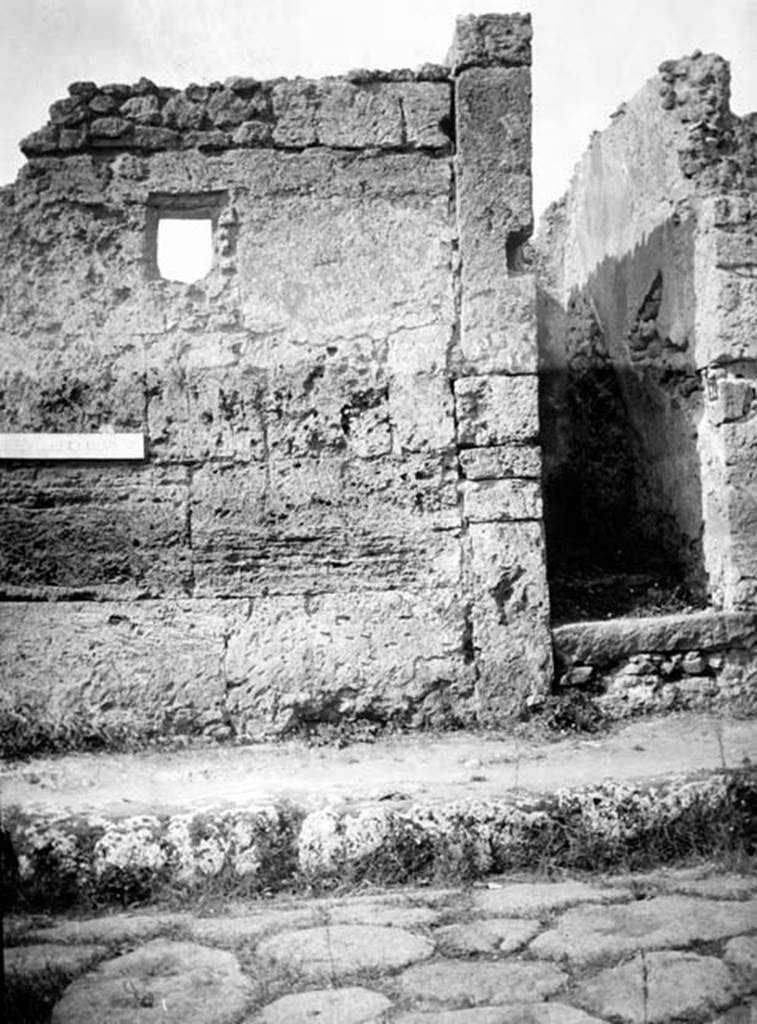 231127 Bestand-D-DAI-ROM-W.1253.jpg
VI.7.24 Pompeii. W.1253. Façade and doorway on Via Mercurio. The wall is to the south of the doorway. In the plaster on the north wall of the entrance doorway, the outline of the line of the stairs can be seen.
Photo by Tatiana Warscher. With kind permission of DAI Rome, whose copyright it remains.
See http://arachne.uni-koeln.de/item/marbilderbestand/231127