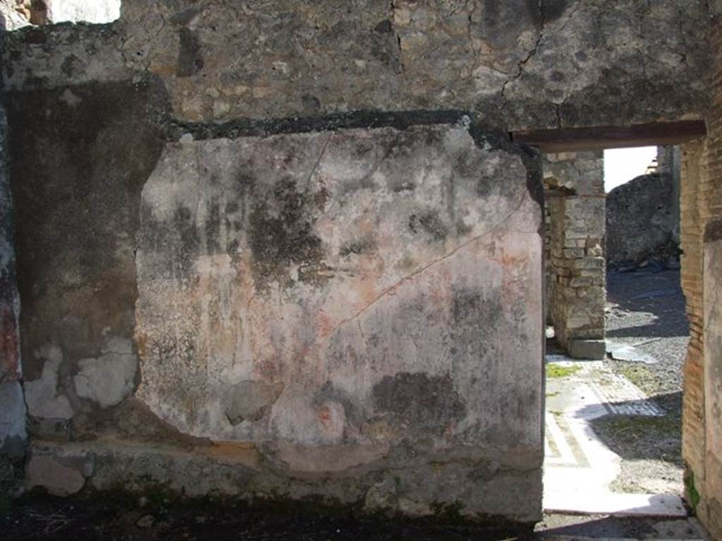 VI.8.20 Pompeii. March 2009. Room 5, south wall with bed recess, in alcove on left (east), and doorway to room 6.
According to PPM – the middle zone of the wall in the antecamera would have had red panels, with a yellow panel in the alcove.