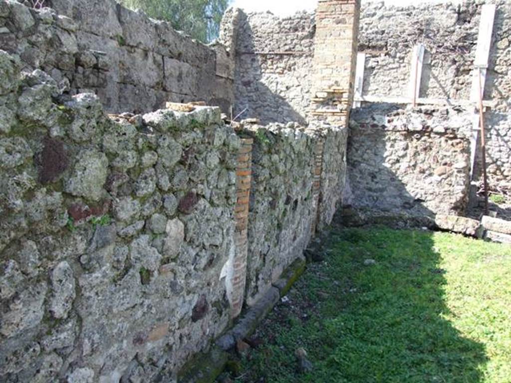 VI.8.20 Pompeii. March 2009. Looking north along west side of peristyle. The columns have been filled in with walls.