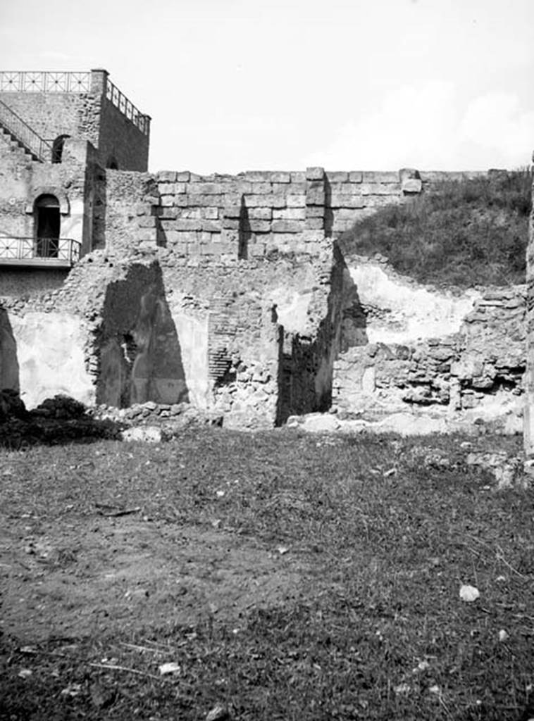 231225 Bestand-D-DAI-ROM-W.637.jpg
6.9.1 Pompeii. W637. 
Looking north from garden area (room 18) towards rooms 12, 11, and small corridor leading to room 8.
Photo by Tatiana Warscher. With kind permission of DAI Rome, whose copyright it remains. 
See http://arachne.uni-koeln.de/item/marbilderbestand/231225  
According to Warscher, in room 11, (Warscher�s room �L� the yellow triclinium, seen left of centre in the photo), in the left wall was a hole. It could not be excluded that this hole was what remained after the painting of Io was taken out.
See Warscher, T, 1938: Codex Topographicus Pompejanus, Regio VI, insula 9: Pars prima, (no.17c), DAIR, Rome.  

