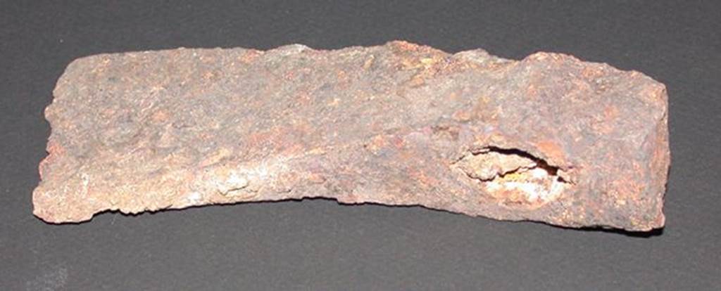 VI.9.1 Iron axe head, rear view.  Height 0.033m, width 0.057m, length 0.14m.  
OA 2811 Hache, mus�e Cond�, photo RMN � R.G. Ojeda