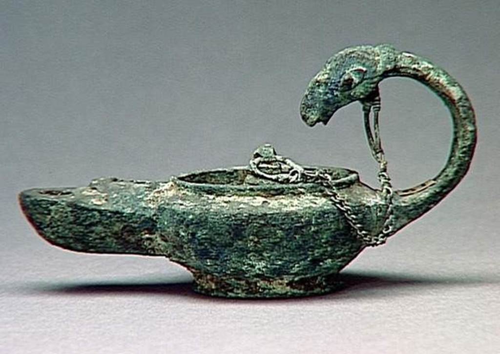 VI.9.1 Bronze lamp. Height 0.13m, length 0.14m. OA 1825 Lampe, musée Condé, photo RMN © R.G. Ojeda