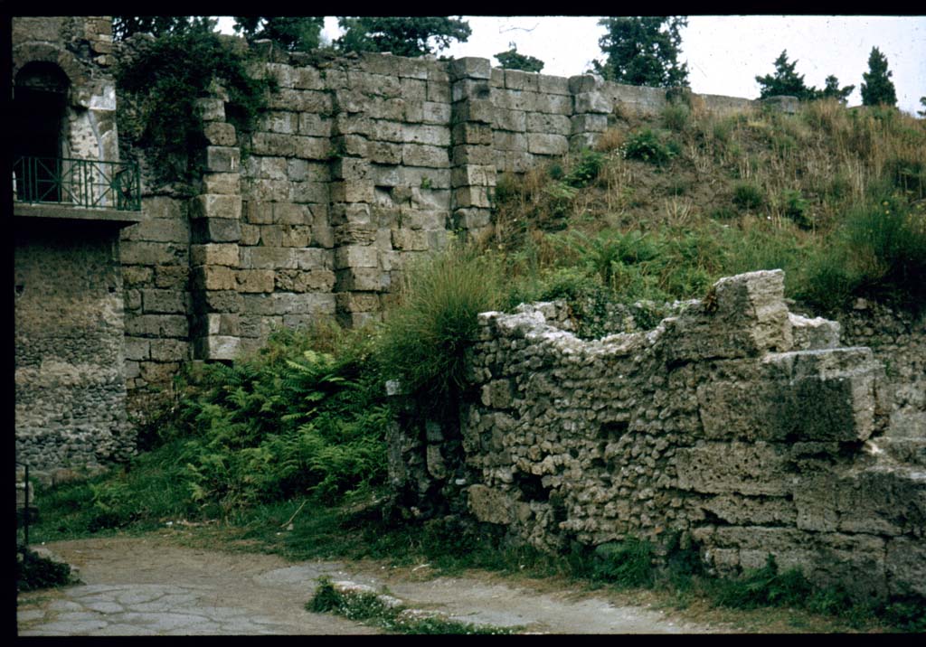 VI.9.1 Pompeii. North-west corner of exterior front wall on Via di Mercurio, with Tower XI and City Walls.
Photographed 1970-79 by Günther Einhorn, picture courtesy of his son Ralf Einhorn.