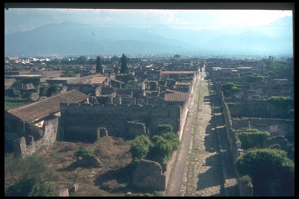 VI.9.1 Pompeii, shown on left front of picture. Looking south along Via di Mercurio, from Tower XI.
Photographed 1970-79 by Günther Einhorn, picture courtesy of his son Ralf Einhorn.