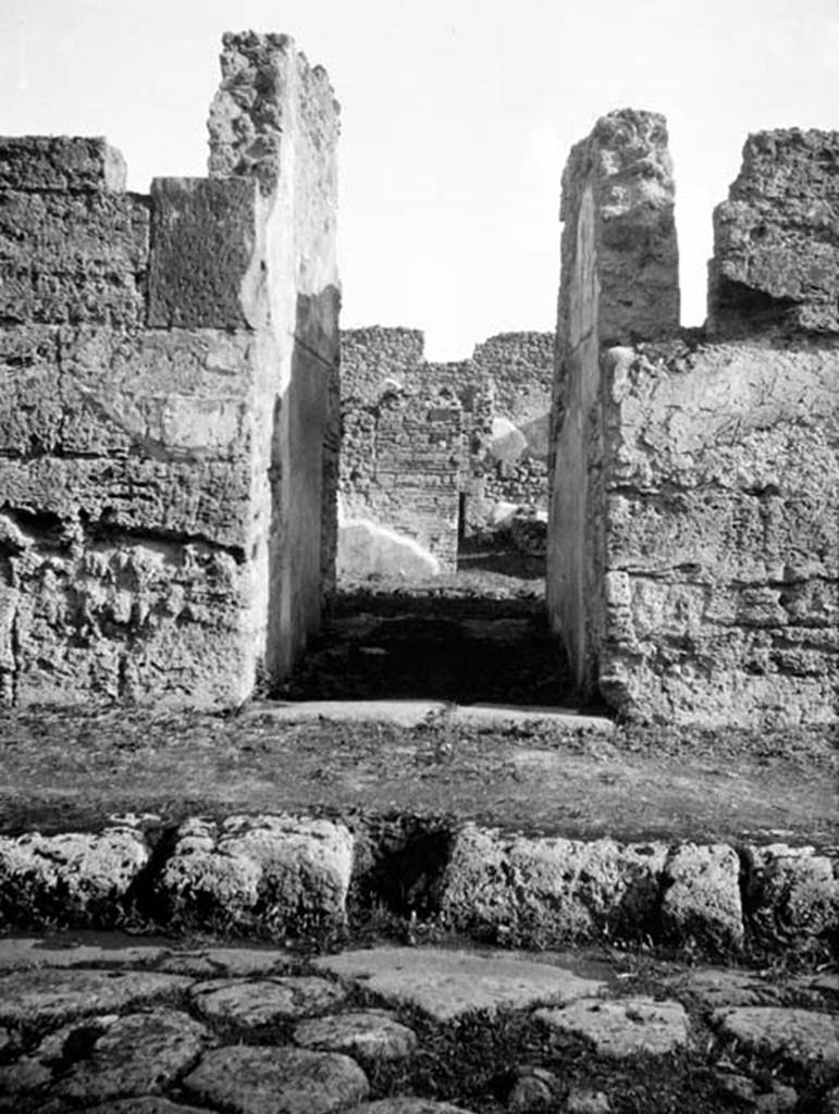 231030 Bestand-D-DAI-ROM-W.626.jpg
6.9.1 Pompeii. W 626 Entrance doorway, looking east.
Photo by Tatiana Warscher. With kind permission of DAI Rome, whose copyright it remains.
See http://arachne.uni-koeln.de/item/marbilderbestand/231030
According to Warscher, quoting Nissen, in the entrance corridor, on the left of the doorway, a square hole in the wall for fixing a bar to barrier the door, could be seen. The threshold of lavastone measured 0,55m in its breadth. The floor was of opus signinum of the later period. The two entrance corridor walls, 3,55m in length, still showed some miserable traces of paintings.
See Warscher, T, 1938: Codex Topographicus Pompejanus, Regio VI, insula 9: Pars prima, (no.5), DAIR, Rome.