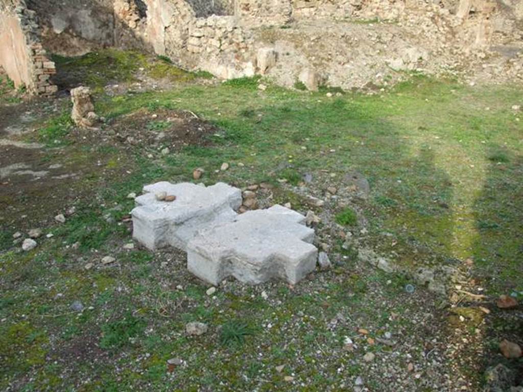 VI.9.1 Pompeii. December 2007. Looking north-east from atrium towards room 11, in rear left. According to Warscher, quoting Fiorelli,
“The solid remains of travertine on which rested the chest for money paid by patrons can still be seen in the atrium, standing in front of three doors: the first that led into a second triclinium, (our room 11), followed by three rustic rooms at the top, and a cubiculum below with painted plaster. The second doorway (see photograph no. 19), and the third doorway (see no. 13) both entered into the walkway on the north side of the xystus, defined by a podium, and with channels to receive the flowing rain in two cistern mouths”, (see also Warscher’s photograph no. 23).
See Pappalardo, U., 2001. La Descrizione di Pompei per Giuseppe Fiorelli (1875). Napoli: Massa Editore. (p.63)
See Warscher, T, 1938: Codex Topographicus Pompejanus, Regio VI, insula 9: Pars prima, DAIR, Rome.