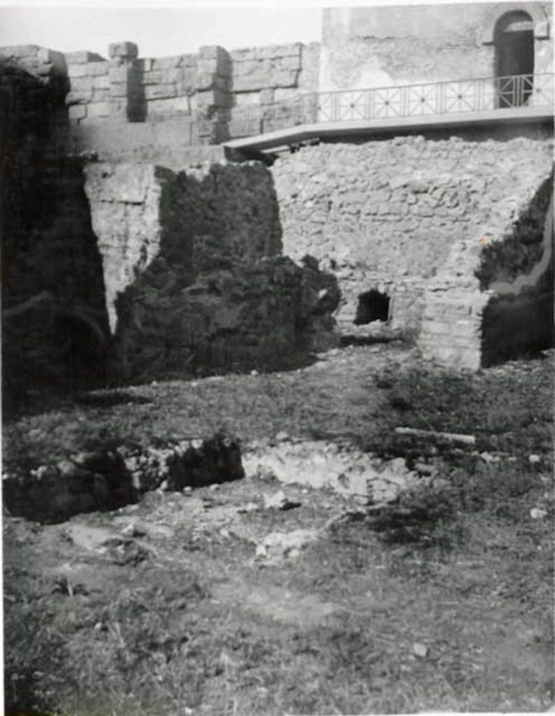 VI.9.1 Pompeii. Looking north-west across atrium towards storeroom, on left, and kitchen, in centre. According to Warscher, one could see the impluvium in the atrium and the piece of marble that remained as proof that it was once covered with marble. To the right of the oven was the wall that separated the kitchen from the atrium, and was also the west wall of room she called “ala K”
See Warscher, T, 1938: Codex Topographicus Pompejanus, Regio VI, insula 9: Pars prima, (no.15), Rome, DAIR, whose copyright it remains.