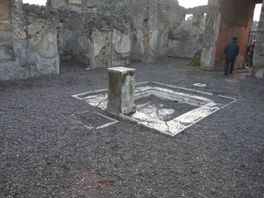 VI.9.2 Pompeii. December 2007. Room 2, atrium, impluvium 3 and pedestal 5, looking south-west towards room 10. In the left foreground behind pediment 5 and originally under the table 6 are two square marble recesses 7. According to Overbeck and Mau these were for cooling bottles. See Overbeck J., 1884. Pompeji in seinen Geb�uden, Alterth�men und Kunstwerken. Leipzig: Engelmann, p. 308.