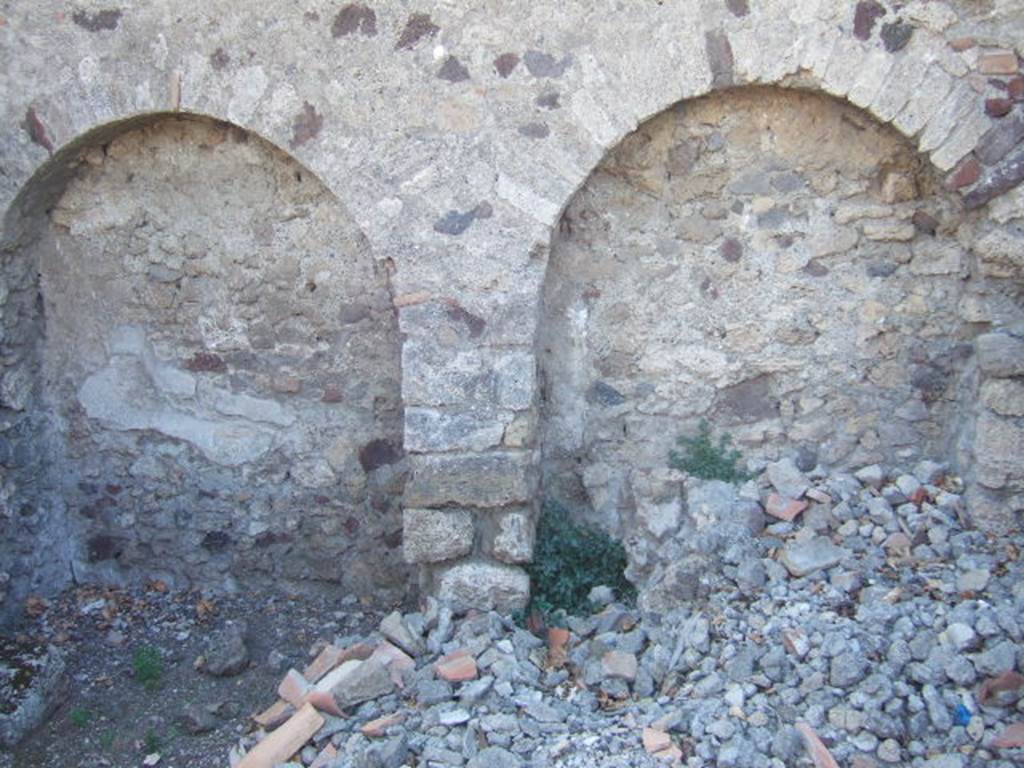 VI.9.2 Pompeii. September 2004. Room 38, west wall of kitchen. The lararium painting was found in an area marked �u� on a plan by Overbeck. This would coincide with the arched area on the right.
