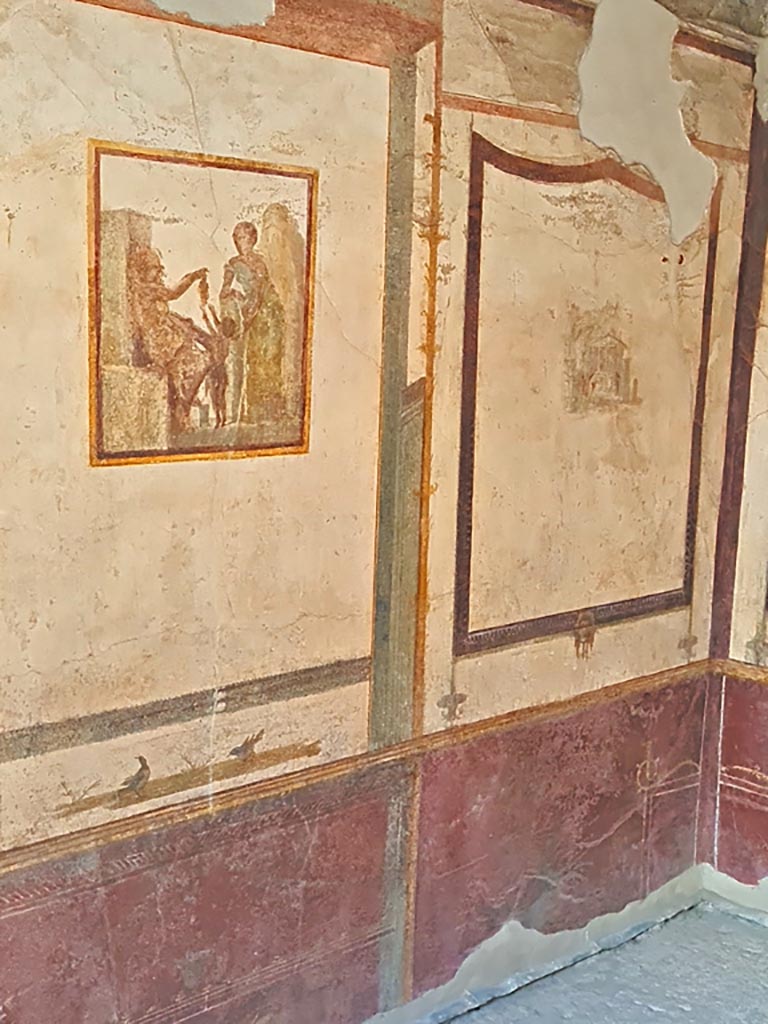 VI.9.6 Pompeii. November 2023.
Room 21, central painting on south wall and south-west corner. Photo courtesy of Giuseppe Ciaramella.