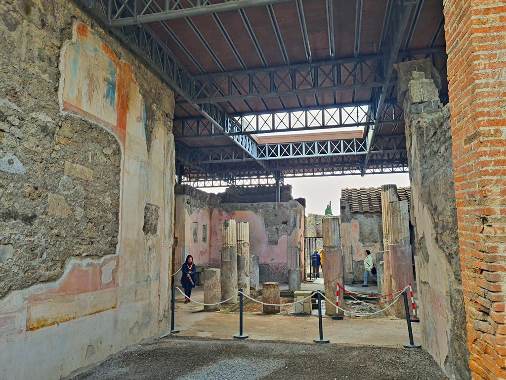VI.9.6 Pompeii. November 2023.
Room 9, looking west through tablinum towards atrium and entrance doorway, from west portico of garden area.
Photo courtesy of Giuseppe Ciaramella.
