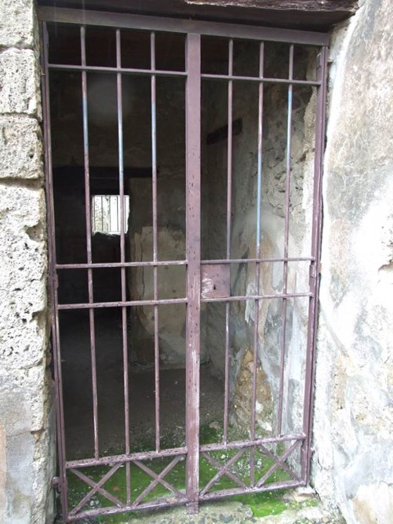VI.10.1 Pompeii. March 2009. Doorway to two rooms on south side of east wall of bar-room.
According to Boyce, on the south wall beneath the stairs was a lararium painting: 
A single serpent about to devour the offerings � an egg and a pine cone � on a burning altar.
See Boyce G. K., 1937. Corpus of the Lararia of Pompeii. Rome: MAAR 14.  (p.50, no.180).
(Note: in Part 1 of VI.10.1, the lararium painting can be seen (courtesy of William Gell) against the west wall.)
According to Eschebach, near the stairs was the doorway into the two rooms on the south side.
See Eschebach, L., 1993. Geb�udeverzeichnis und Stadtplan der antiken Stadt Pompeji. K�ln: B�hlau. (p.192)

