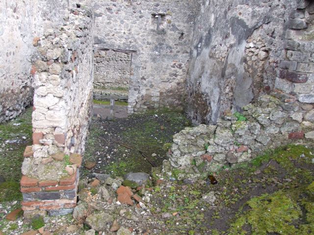VI.10.4 Pompeii. March 2009. Looking along north wall of atrium area to two doors into rear of VI.10.3.