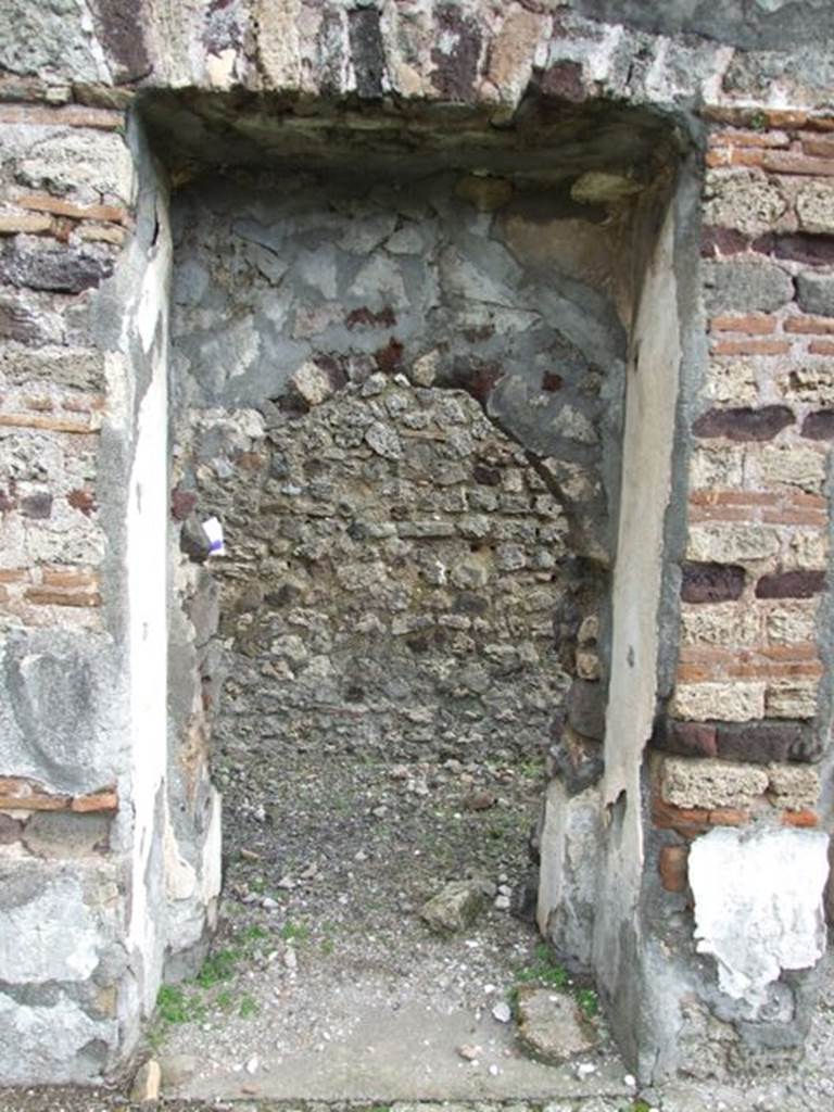VI.10.7 Pompeii. March 2009. Room 15. Garden area. East side. Arched doorway to corridor on east side.