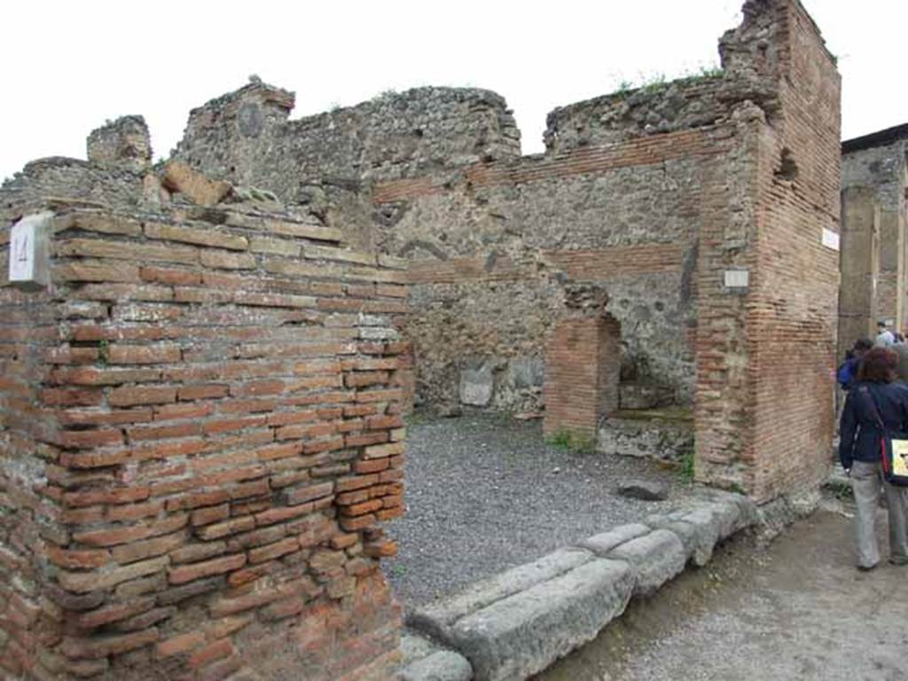 VI.10.15 Pompeii. May 2010. Looking east to shop. According to Pagano and Prisciandaro, found in April 1824 on the pilaster on the left of the entrance, was �
Priscum    [CIL IV 263]
Found in September 1829, on the pilaster on the south-east corner of the insula (on the right of the photo above) was �
C(aium) Calventium Sit[3]
IIvir(um) i(ure) d(icundo)    [CIL IV 276]
See Pagano, M. and Prisciandaro, R., 2006. Studio sulle provenienze degli oggetti rinvenuti negli scavi borbonici del regno di Napoli.  Naples : Nicola Longobardi. (p.142)  PAH II, 224; III (dated 17th March 1831), 115.

