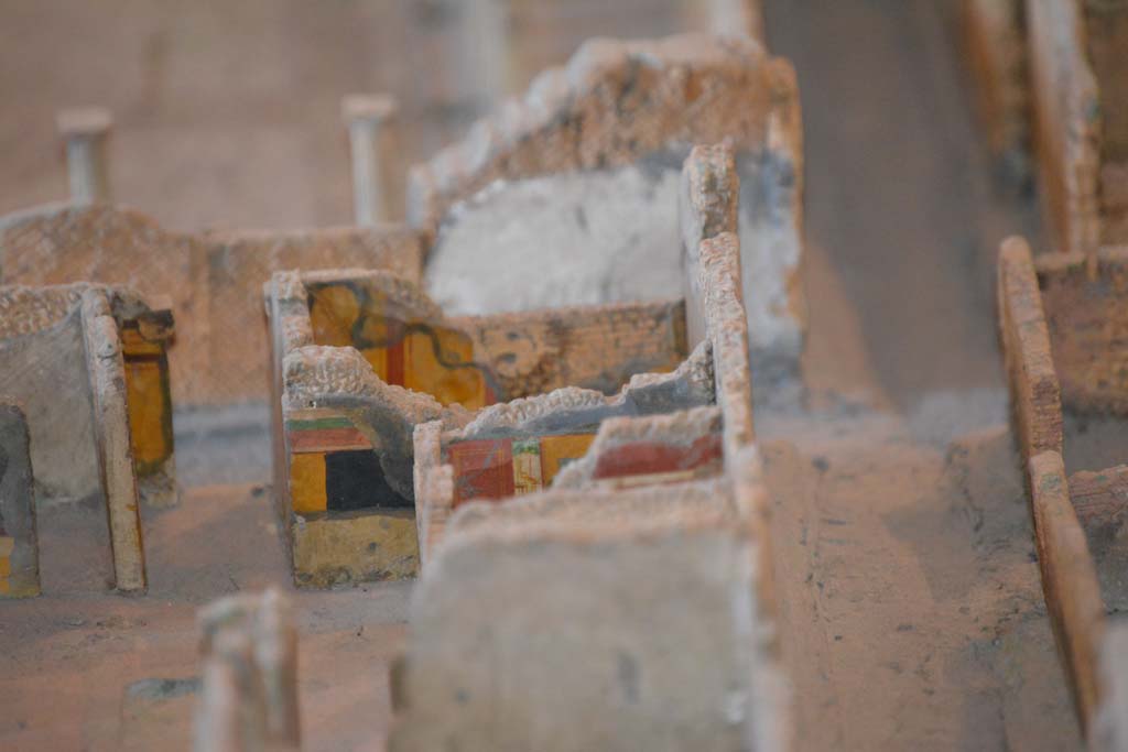 VI.11.9/10 Pompeii. July 2017. Looking towards south-west corner of atrium 3, with Vicolo del Fauno, on right.
Above the yellow/black wall of the atrium is the south wall of room 5, unseen in front of it would be corridor 4.
The red/yellow south panelled wall of room 6 can be seen, with a small part of the remaining red painted upper south wall of west ala 7, in the centre.
From cork model in Naples Archaeological Museum.
Foto Annette Haug, ERC Grant 681269 D�COR.
