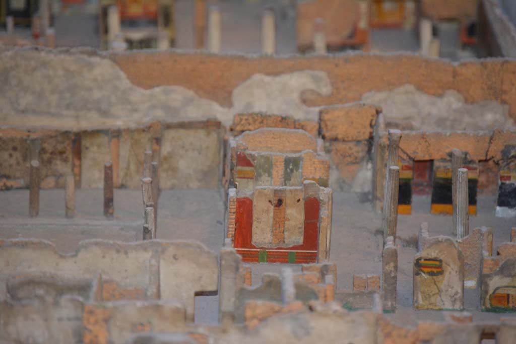 VI.11.9/10 Pompeii. July 2017. Looking east towards red painted east wall of room 35, in centre.
At the rear of this room, the east wall of tablinum 33 can be seen.
From cork model in Naples Archaeological Museum.
Foto Annette Haug, ERC Grant 681269 D�COR.
