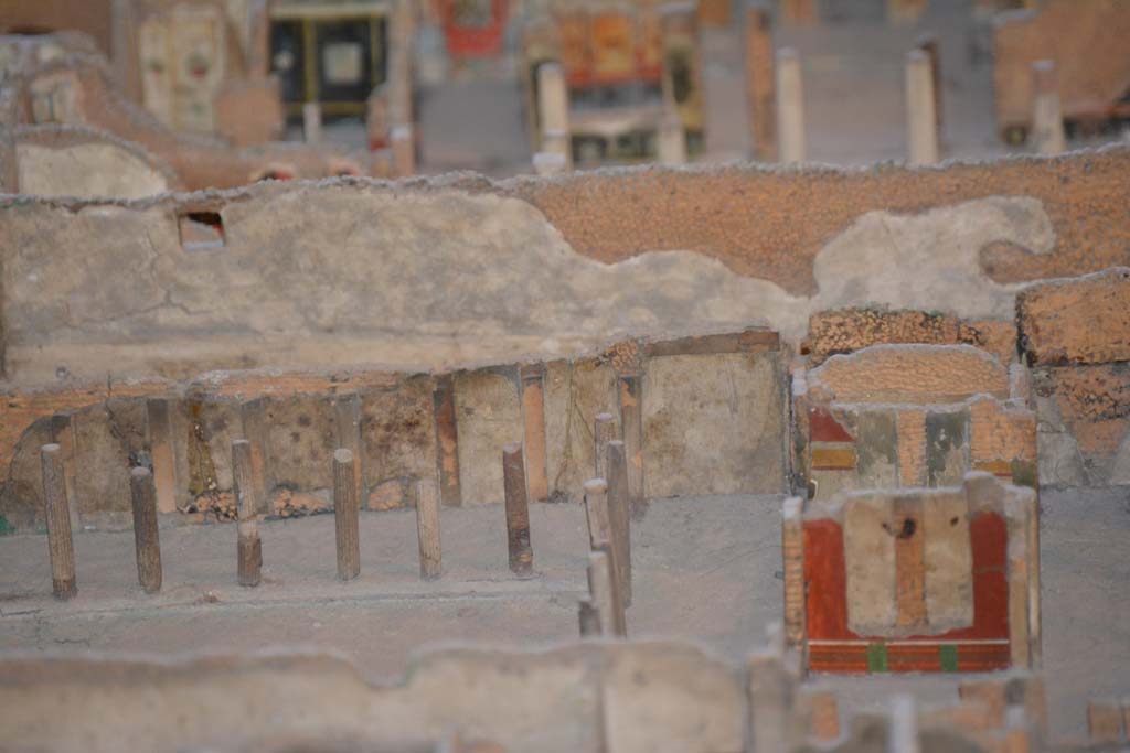 VI.11.9/10 Pompeii. July 2017. Looking east towards south-east corner of peristyle 36, with walls of rooms 33 and 35, visible on right.
From cork model in Naples Archaeological Museum.
Foto Annette Haug, ERC Grant 681269 D�COR.

