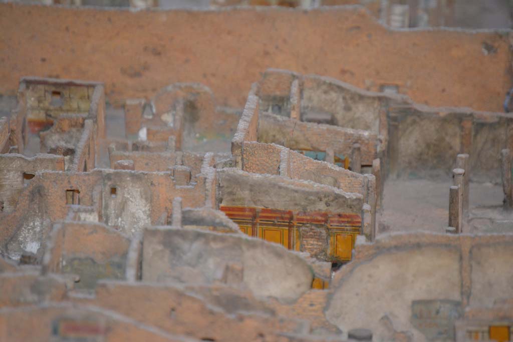 VI.11.9/10 Pompeii. July 2017. 
Looking towards east wall of peristyle 36, with east walls of rooms 40, (yellow painted, lower left), 42, 43 and 46, visible in centre.
From cork model in Naples Archaeological Museum.
Foto Annette Haug, ERC Grant 681269 D�COR.
