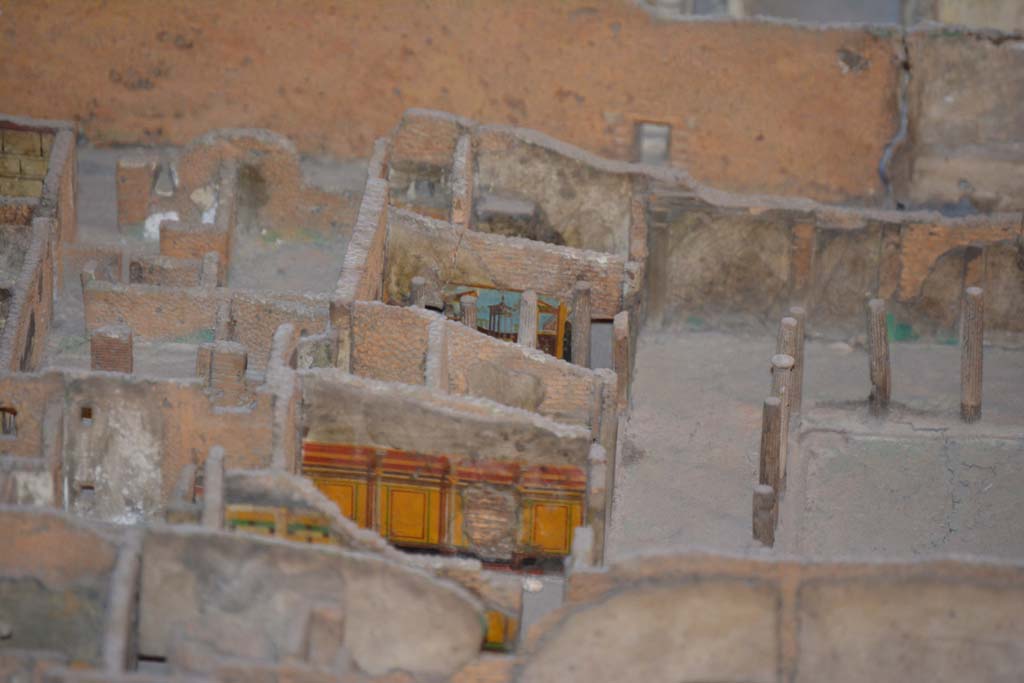 VI.11.9/10 Pompeii. July 2017. 
Looking towards north portico of peristyle 36, with east walls of rooms 39, just visible, 40, (yellow painted, in centre), 42, 43 (Corinthian oecus) and 46, visible on left.
From cork model in Naples Archaeological Museum.
Foto Annette Haug, ERC Grant 681269 D�COR.
