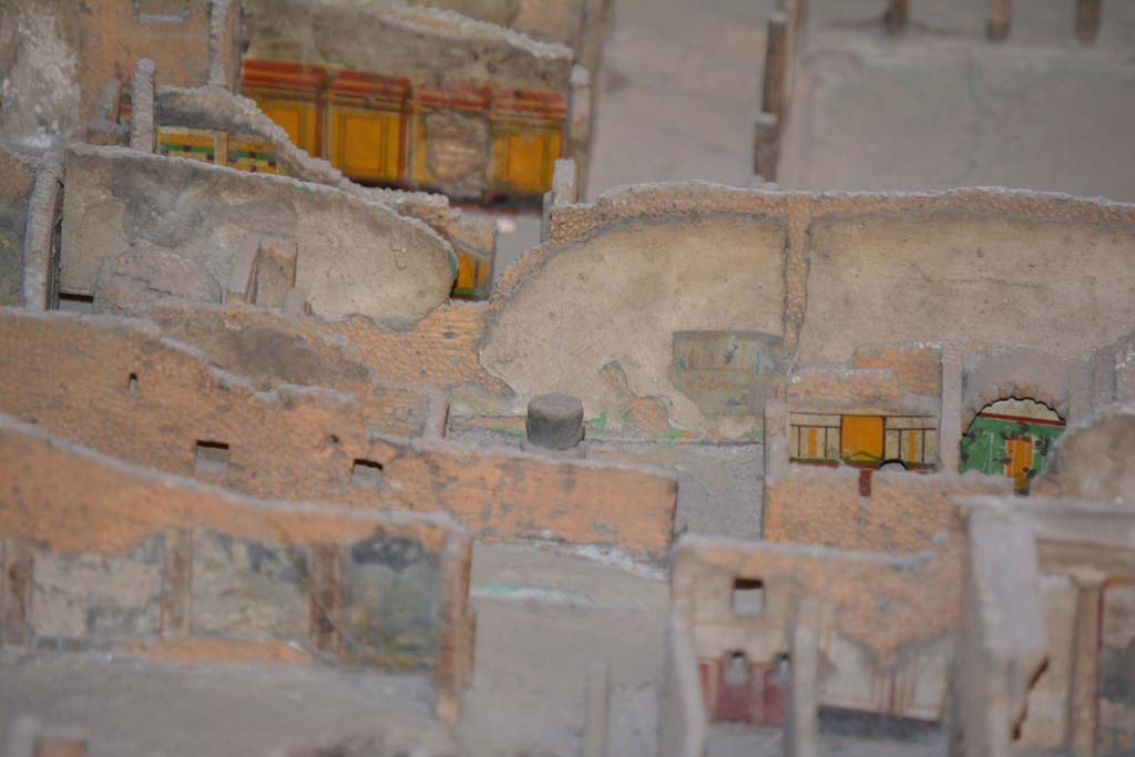 VI.11.9/10 Pompeii. July 2017. Across centre, looking east towards bakery wall in room 16 with lararium painting.
In the centre, on the right, are the painted east walls of room 20 and 21 of the baths� area.
Note the entrance doorway, now blocked, leading from Vicolo del Fauno directly into the bakery.
From cork model in Naples Archaeological Museum.
Foto Annette Haug, ERC Grant 681269 D�COR.
