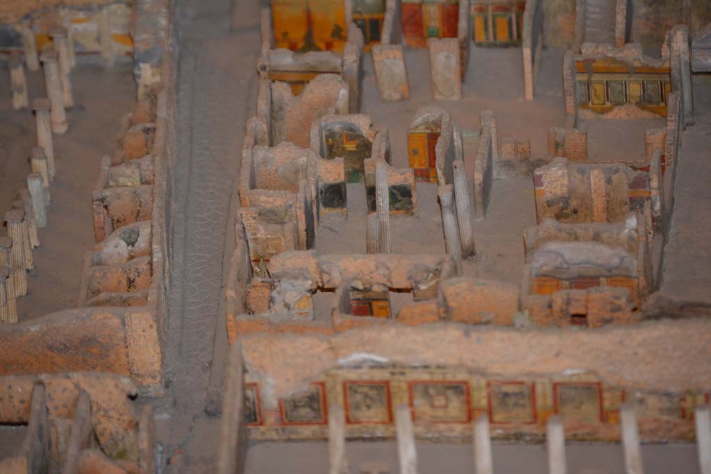 VI.11.9/10 Pompeii. July 2017. Top right, below the stairs, looking towards west wall of room 38, with window into room 35.
Beneath the window, the west wall of tablinum 33 can be seen. 
Across the centre, the west side of atrium 27 features the black painted room 28, the yellow/red painted room 29, undecorated corridor 48, and room 31, west ala.
From cork model in Naples Archaeological Museum.
Foto Annette Haug, ERC Grant 681269 D�COR.
