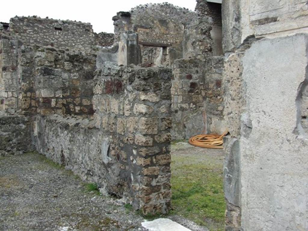 VI.11.10 Pompeii. March 2009. Room 31 on the left, and doorway into room 35 on the right. Looking west.