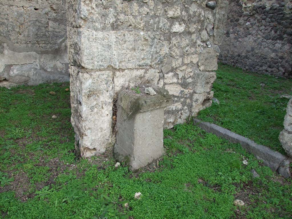 VI.11.19 Pompeii. December 2007.
Household altar near east wall of atrium, with doorway to room 12, on left, and to room (11) on right.
According to Boyce, against the east wall of the atrium, to the left of the entrance, stands an altar of tufa*.
This altar was apparently coated with a layer of stucco in the late days of the city.
On the wall above it were painted the two serpents confronted at a painted altar furnished with a pine cone.
See Boyce G. K., 1937. Corpus of the Lararia of Pompeii. Rome: MAAR 14. (p.51, no.188)
* note on page 51 reads – according to Pernice, “the altar dates from the earlier Tufa Period and still stands against the tufa wall where it was originally placed”.
* see Pernice, Hellenistische Tische, 66 and pl. 40,1.
See Giacobello, F., 2008. Larari Pompeiani: Iconografia e culto dei Lari in ambito domestico. Milano: LED Edizioni. (p. 242)