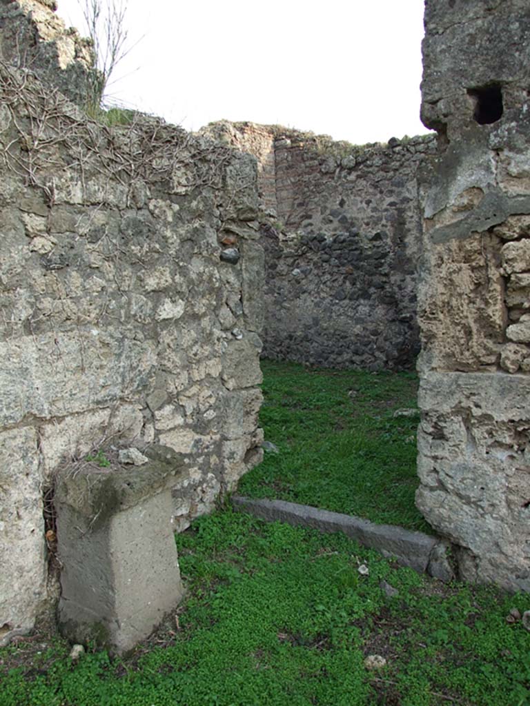 VI.11.19 Pompeii. December 2007.
Doorway to east room on the south side, (room 11) kitchen leading to yard, and entrance/exit at VI.11.18.