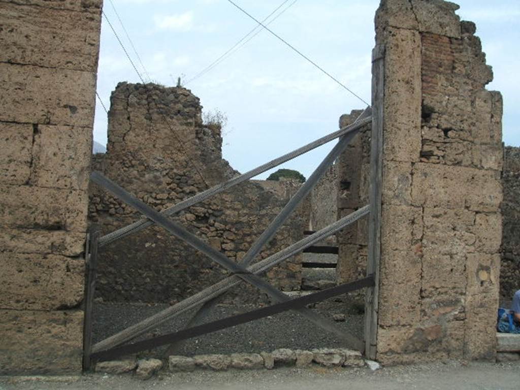 VI.13.1 Pompeii. December 2007. East wall of shop with doorway to the atrium of VI.13.2 in the north-east corner.  
