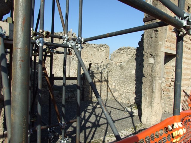 VI.13.3 Pompeii. December 2007. Looking towards north wall of shop.
Doorway on left led to the atrium of VI.13.2. Doorway on right led to a cubiculum of VI.13.2.