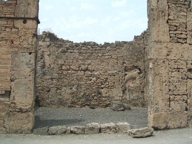 VI.13.5 Pompeii. December 2007. North and east walls of shop.