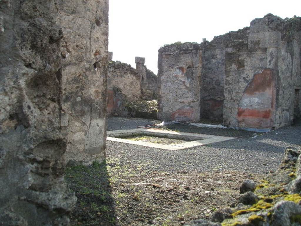 VI.13.8 Pompeii. December 2004. Looking south-west from rear entrance, towards atrium. According to Garcia y Garcia, in 1943 a bomb destroyed the rear entrance. The three nearby rooms on the south-east side of the peristyle were destroyed as well as a good part of the east wall. See Garcia y Garcia, L., 2006. Danni di guerra a Pompei. Rome: L�Erma di Bretschneider. (p.86-87)
According to Della Corte, the peristyle was transformed into a weaving workshop, probably after the earthquake of 62AD. The workers took time to scratch their names in the portico.  The names of seven men were found - Vesbius or Vesbius Tamudianus, Felix, Ephesus, Xanthus, Successus, Faustus, and Florus: The  names of eleven women were found - Vitalis, Florentina, Amaryllis, Ianuaria, Heracla, Maria, Lalage, Damalis,  �.rusa,  .a., Baptis, and Doris.  Della Corte noted that two of the names were Jewish � that of Maria, and Vesbius Tamudianus.    
See Della Corte, M., 1965.  Case ed Abitanti di Pompei. Napoli: Fausto Fiorentino. (p.121) [CIL IV (1493-1509]  
According to Epigraphik-Datenbank Clauss/Slaby (See www.manfredclauss.de), these read as �
Vesbius Tamudianus     [CIL IV 1493]
Pottttas 
X                  [CIL IV 1494]
Vesbius     [CIL IV 1495]
Quibusos  [CIL IV 1496] 
Felix           [CIL IV 1497]
Felix           [CIL IV 1498]
Nero Poppaeeses istis   [CIL IV 1499] 
Cum           [CIL IV 1500]
Vibius        [CIL IV 1501]
Mamoe      [CIL IV 1502] 
Ephesus 
Fututor      [CIL IV 1503] 
Felix           [CIL IV 1504] 
Xanthus    [CIL IV 1505]
Successus     [CIL IV 1506]
Maria pe(nsi) stamen       [CIL IV 1507] 
Nua[3] 
Procu/lus hoc                    [CIL IV 1508]
Faustus Felix F[l]oru(s)   [CIL IV 1509]


