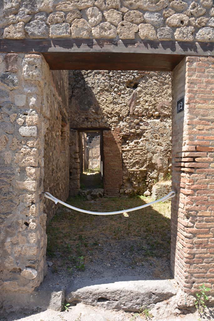 VI.13.12 Pompeii. December 2005. Looking north-west across kitchen area, from entrance doorway.