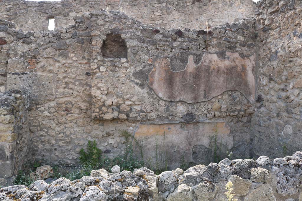VI.14.1 Pompeii. December 2007. Large piece of volcanic tufa left in south-west corner between entrances VI.14.1 and VI.14.44.