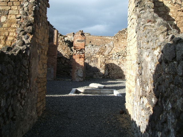 VI.14.5 Pompeii. December 2007. Doorways to cubiculum and tablinum, on north side of atrium.