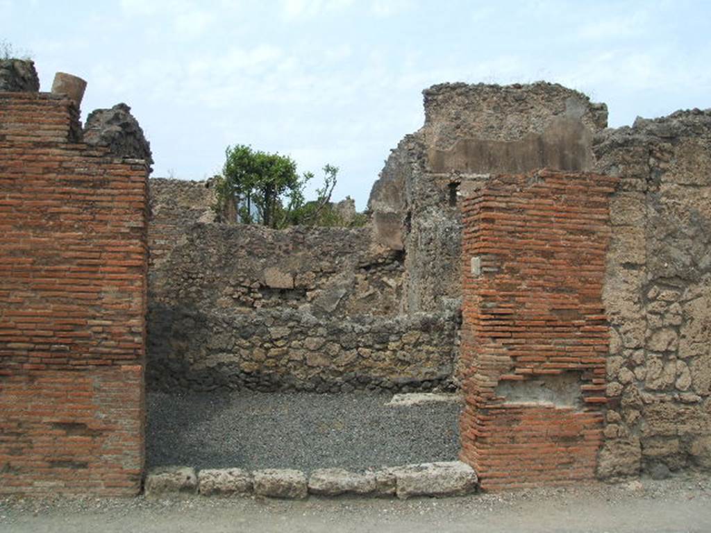 VI.14.7 Pompeii. December 2007. East wall, with base of steps to upper floor in north-east corner.