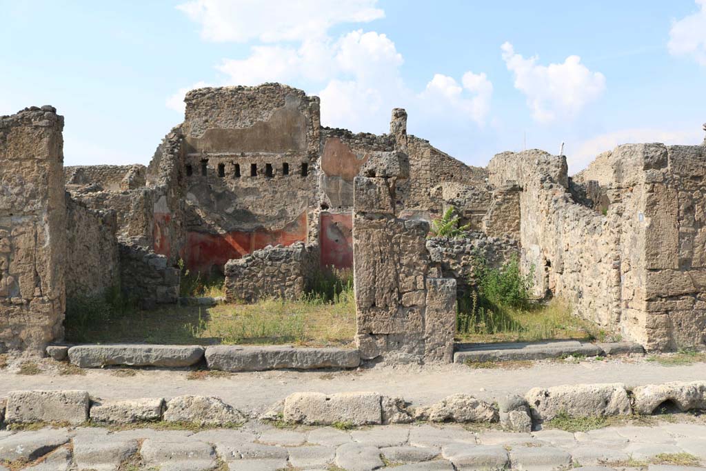 VI.14.8 Pompeii. December 2005. Entrance doorway, looking north across shop to two rear rooms.