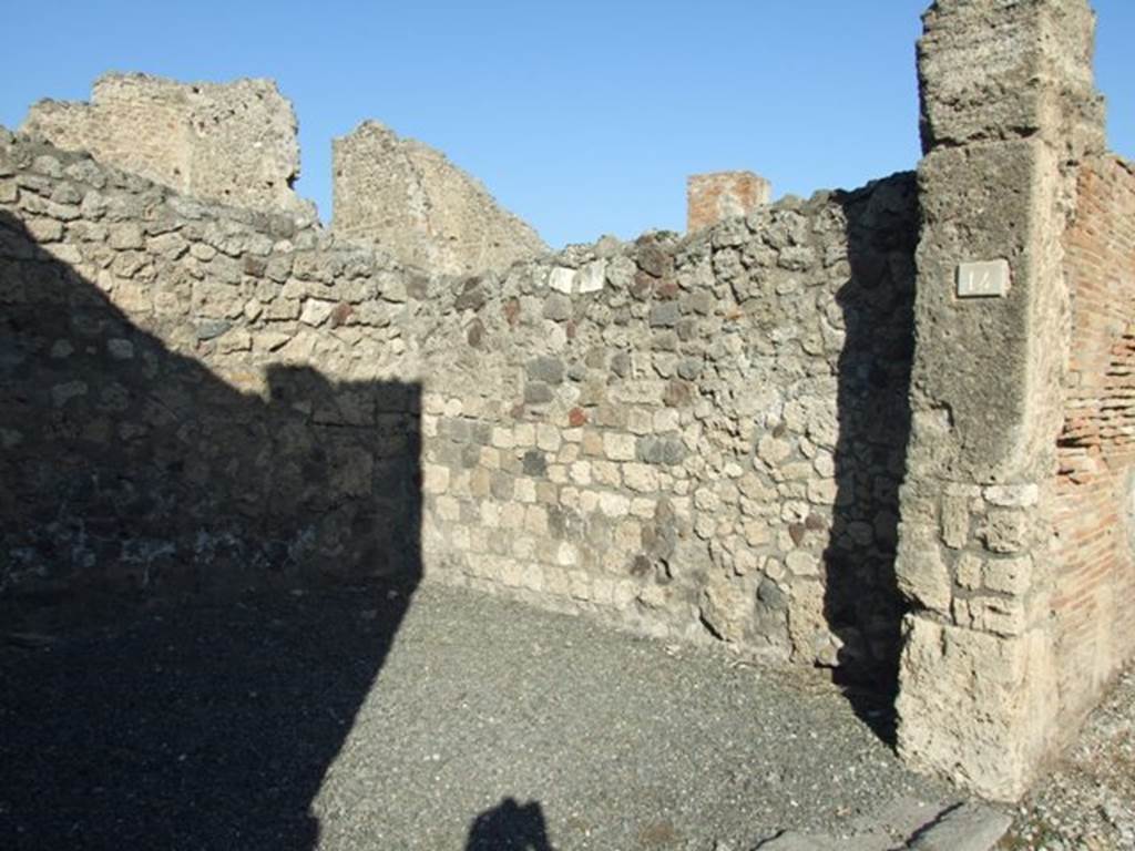 VI.14.14 Pompeii. December 2007. Stone base of wooden staircase to upper storey, in north-west corner near north wall of shop.