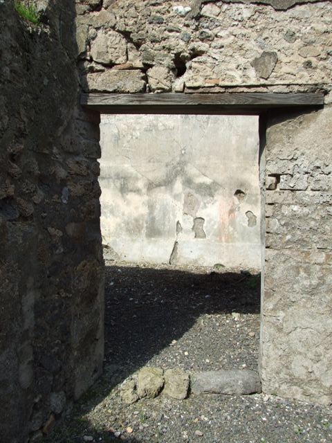 VI.14.20  Pompeii.  March 2009.   Room 17.  South wall with door to portico area.