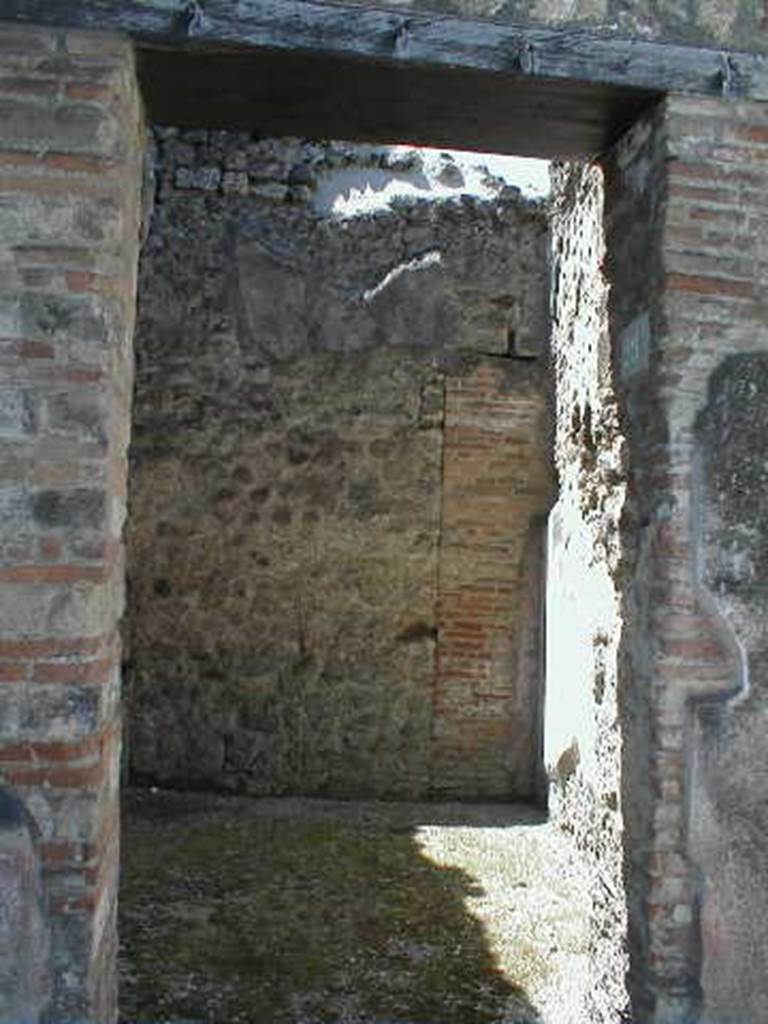 VI.14.29 Pompeii. May 2006. North wall. According to Della Corte, the room of the stairs at VI.14.29 which had originally been a cubiculum of the House of the Laocoonte, was decorated with Style III paintings. These have only been preserved in part on the north wall. In the centre of the north wall was found the picture of a man and a woman on a bed, in front of which is a table with drinks: a servant stands nearby. The painting is now in the Naples Archaeological Museum. Inventory number 111209. Sogliano described it (Sog.641 on p. 131). (Bull.Inst 1876, p.51, and Giorn.Scav.Pomp, n.s. III, p.147).
Another painting, Sogliano S.649, described a female figure lying on a bed. According to Sogliano this was found in the room to the left of the entrance of VI.14.28 (Bull.Inst 1876, p.51), but no decoration has survived. Della Corte thought it may have been from the corresponding room on the upper floor, as did Mau (B.I., 1876, p.49). This painting may have been in the cella meretricia, whose location was unknown.
See Della Corte, M., 1965. Case ed Abitanti di Pompei. Napoli: Fausto Fiorentino. (p.94) See Sogliano, A., 1879. Le pitture murali campane scoverte negli anni 1867-79. Napoli: (p. 131 and p. 133)